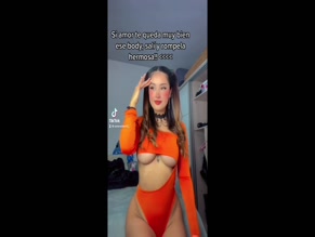 SELENEITOR in SELENEITOR SHOWS OFF HER BIG BREASTS AND ASS IN SEXY ORANGE BODYSUIT(2022)