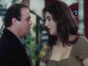 WAFAA AMER in GET RICH OR GET ENAMORED (1994)