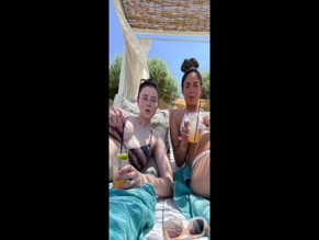 THOMASIN MCKENZIE in THOMASIN MCKENZIE IN SEXY BIKINI WITH HER FRIEND LYING ON A BEACH IN HER TIK TOK2023