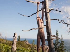 M. M. TOMANOVA NUDE/SEXY SCENE IN WORLD BETWEEN US